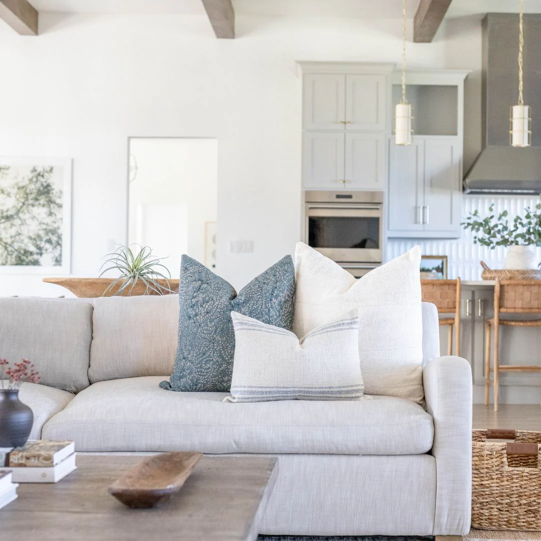 light linen pillows and soft throw blanket in neutral spring living room